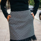 beautiful black haired lady in a black top nad black and white feather skirt - this is a two piece dress, that can be split into top and skirt