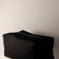 black boxy cosmetic bag with tractor zipper