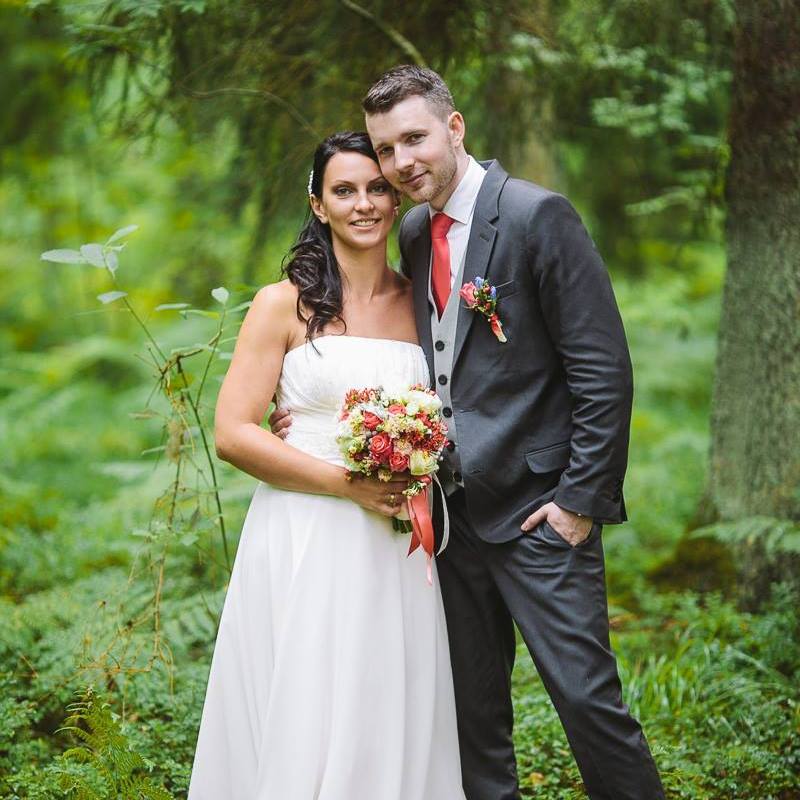 a couple in forest on their wedding day