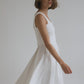 beautiful white two piece dress, lady spinning in it
