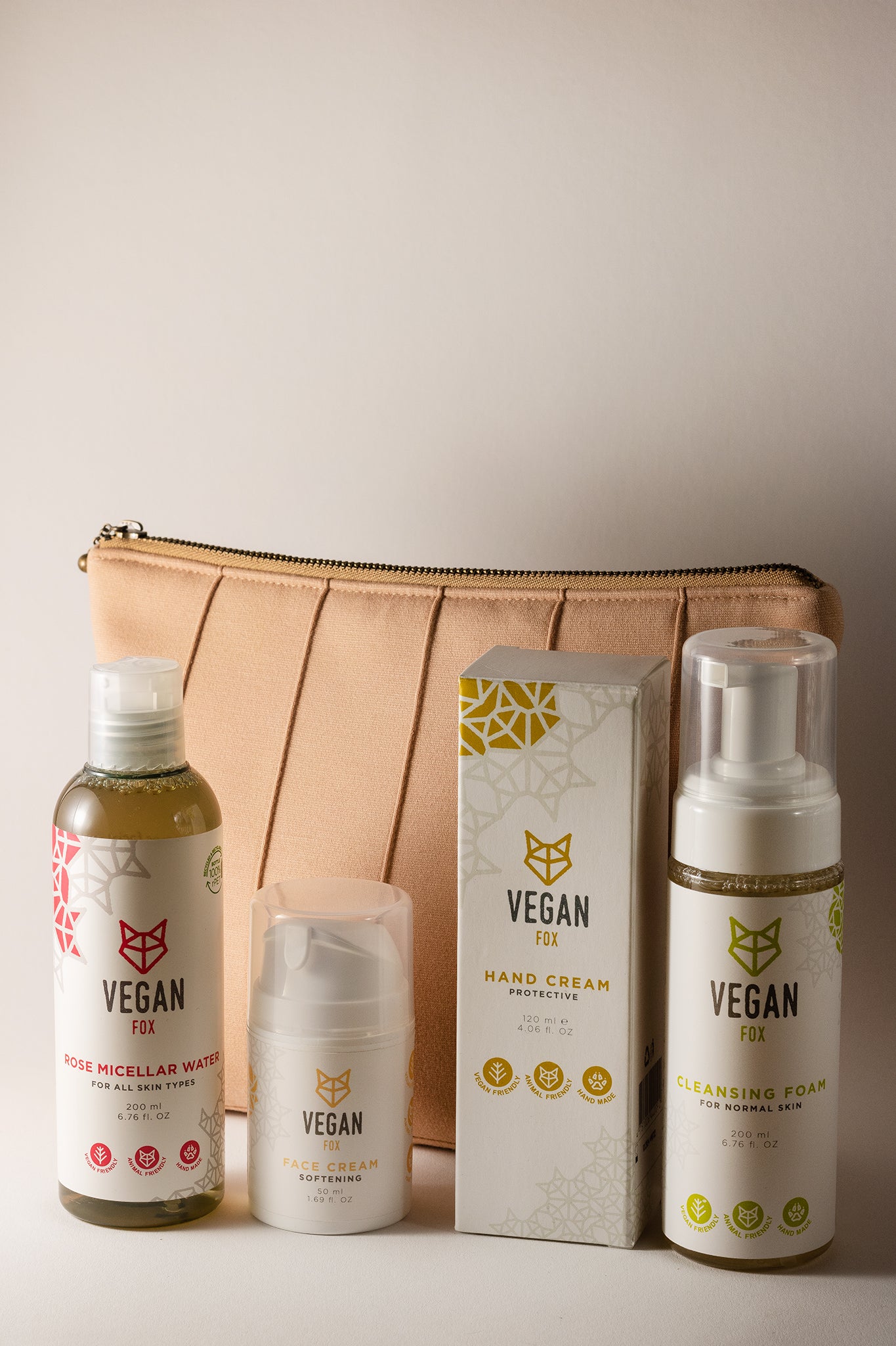 beige cosmetic bag with four vegan fox products