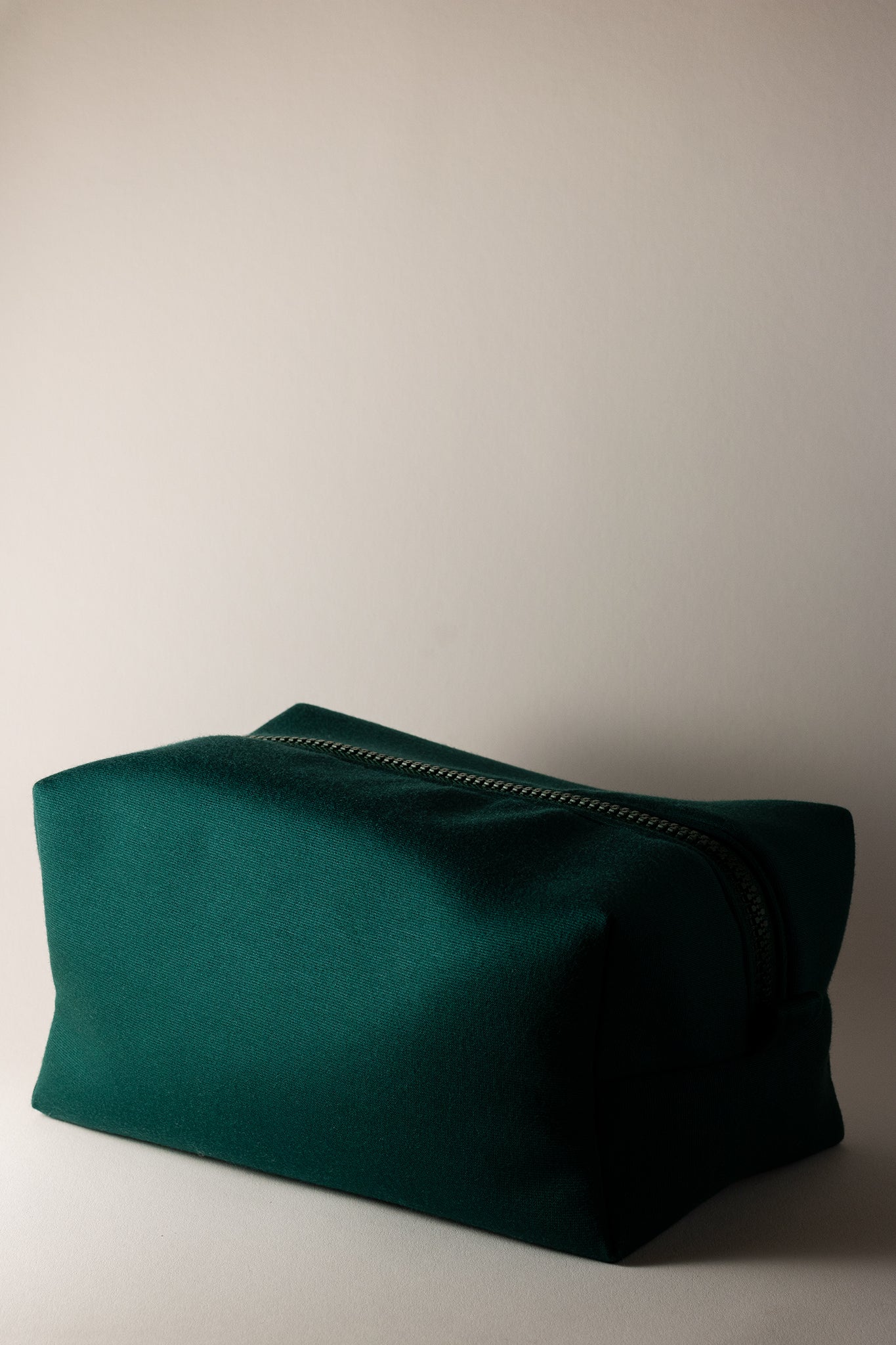 emerald green cosmetic bag with tractor zipper