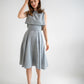 sky blue three-piece dress, that consists of a flowy below-the-knee skirt, a corset top and an overtop - it is a new garment, like a vest with a simple snap closure on the back