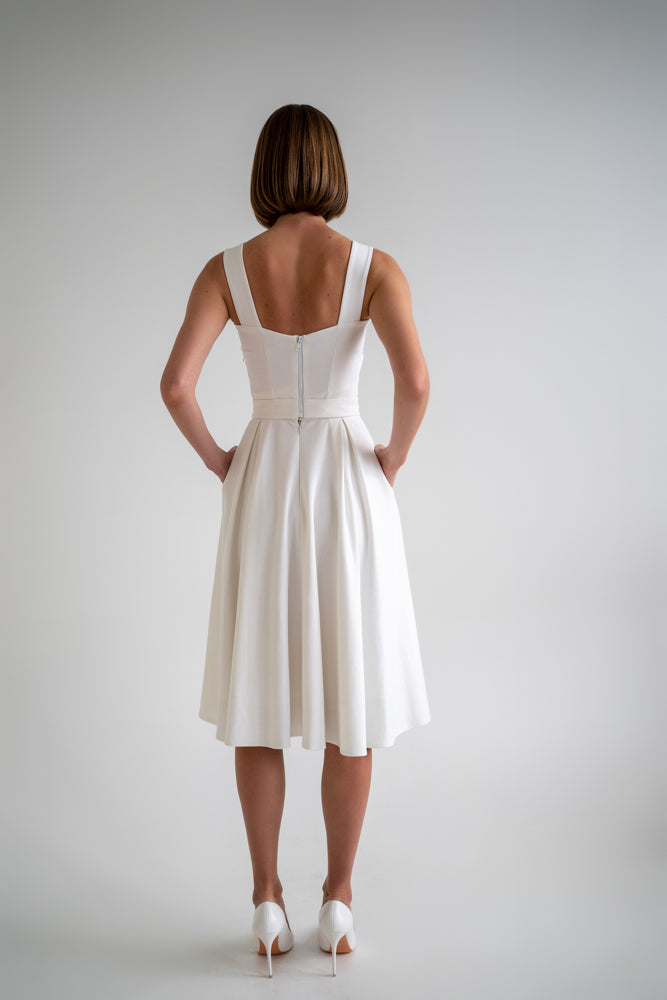 back of the white two piece dress, lady in white shoes