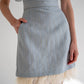 light blue wool skirt with pockets and feather
